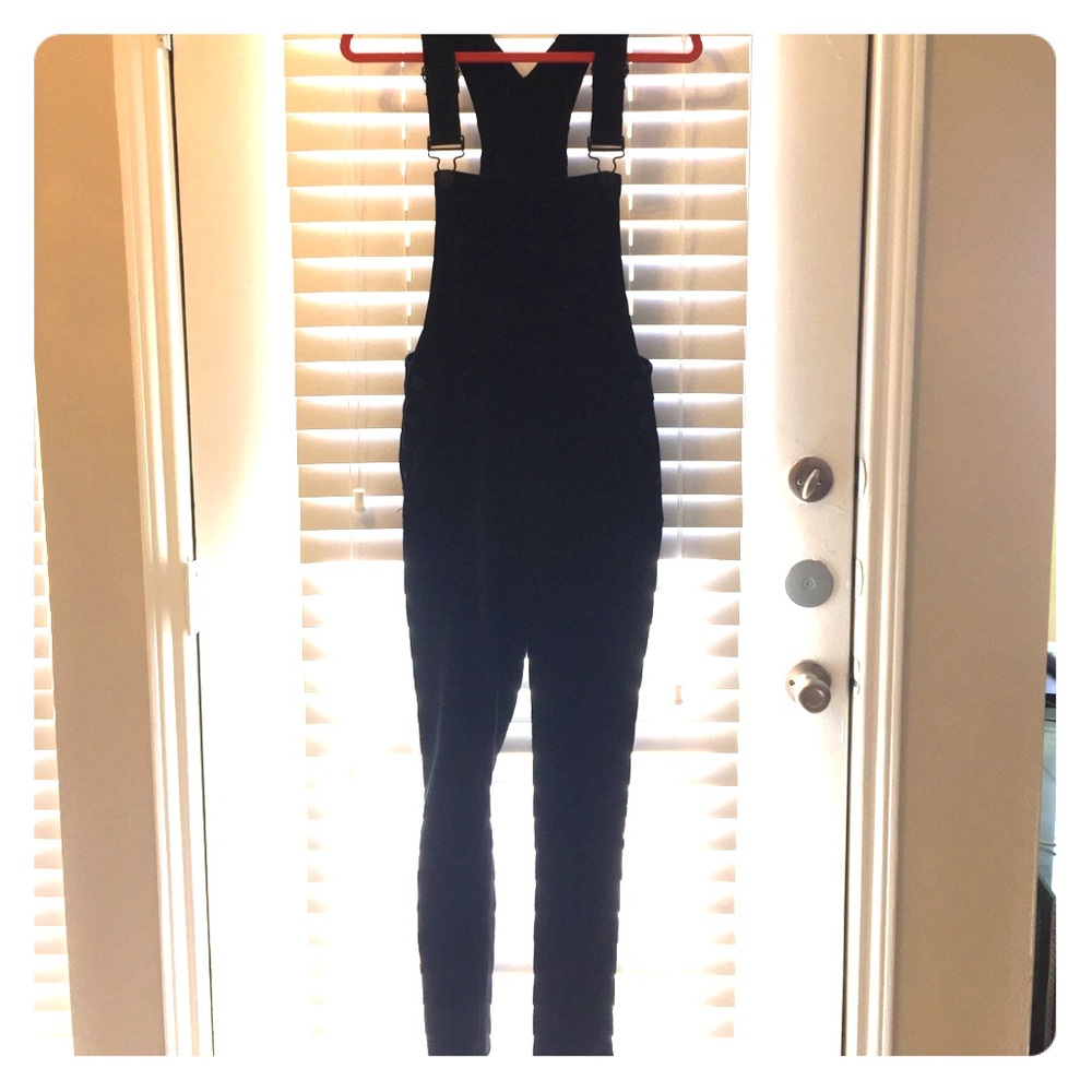 Black full length fashion overalls.